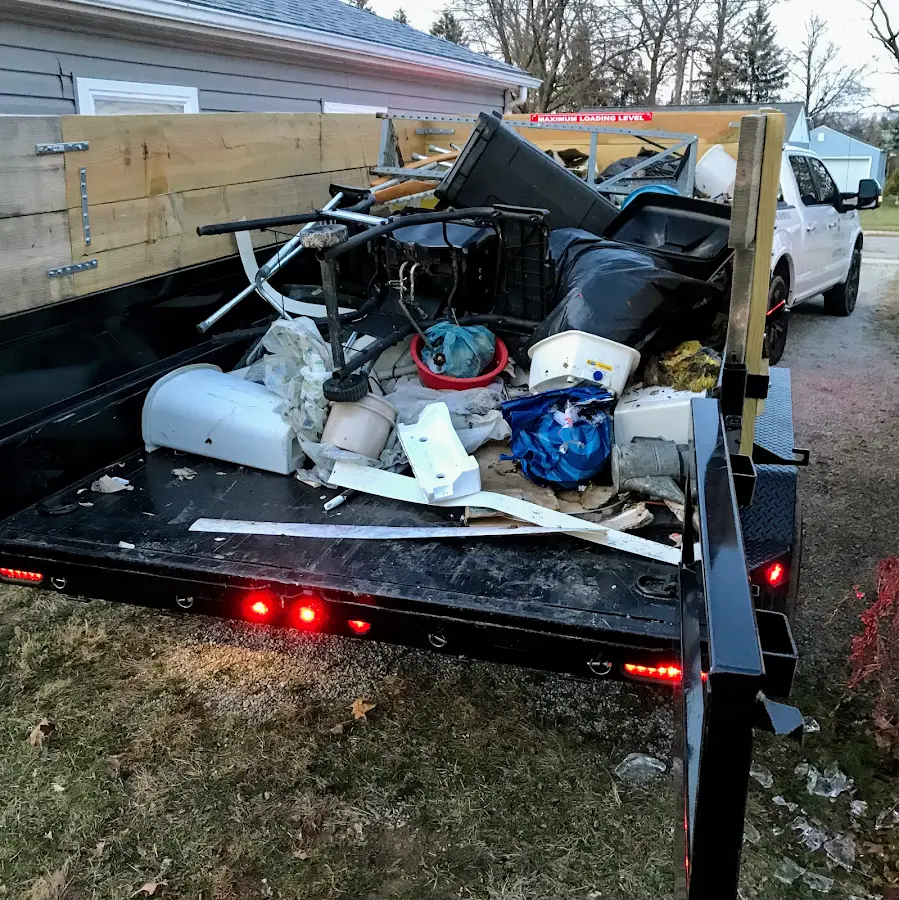 Roll-off dumpster delivered to a residential driveway in Millcreek